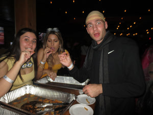 Three people with surprised expression eating fries at a LazSoc event